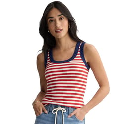 A woman wears a sleeveless red and white striped tank top with navy trim, paired with light blue drawstring pants.