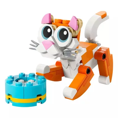 LEGO cat toy with bright eyes, detailed whiskers, and an orange and white color scheme, accompanied by a small turquoise and yellow dish.