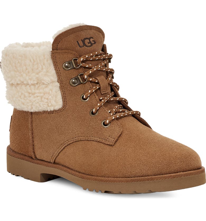 A brown suede lace-up boot with a plush lining visible at the top and a rubber sole, branded with UGG on the tongue.