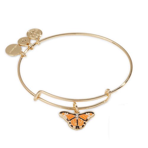 This is a gold-tone bangle bracelet featuring a charm with an orange and black butterfly design.
