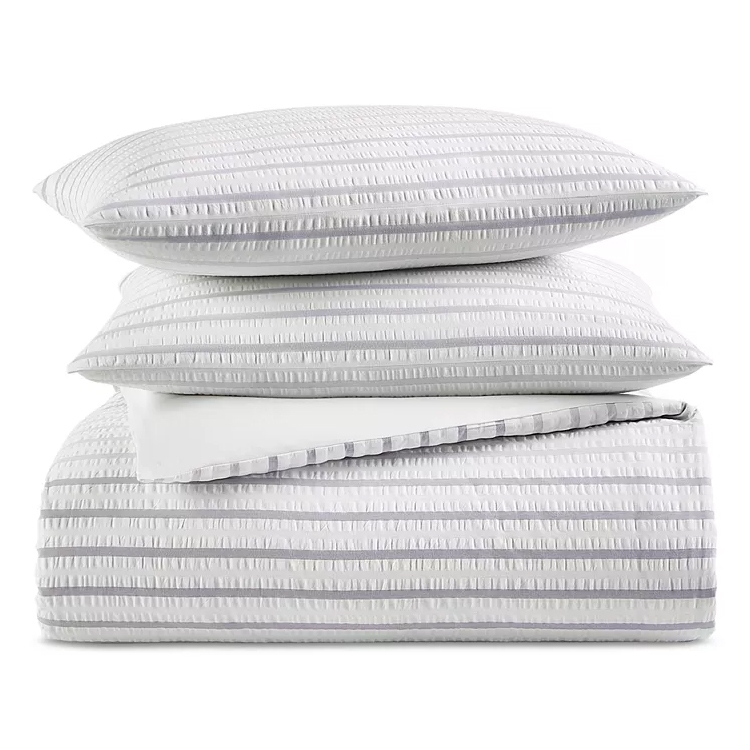 The Charter Club Seersucker Comforter Set includes a comforter and matching pillow shams, featuring a textured striped design in white and gray.