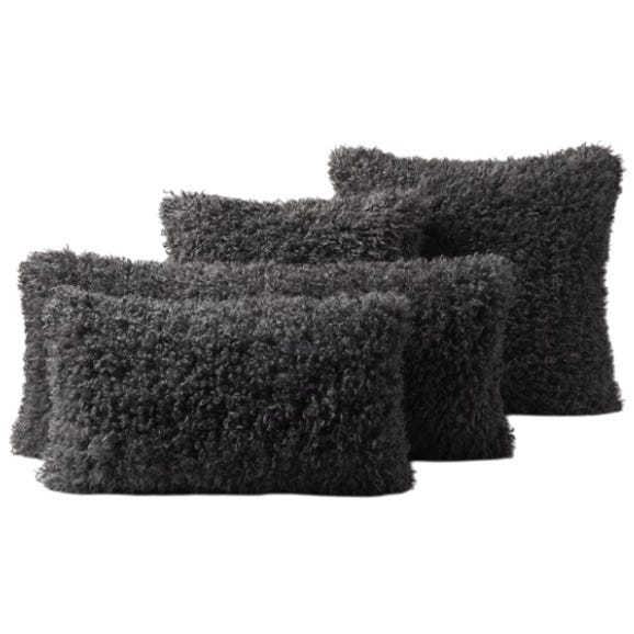 Four dark gray, rectangular, fuzzy pillows with a shaggy texture.