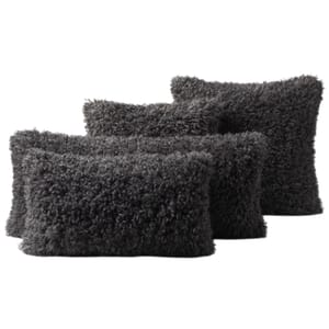Four dark gray, rectangular, fuzzy pillows with a shaggy texture.