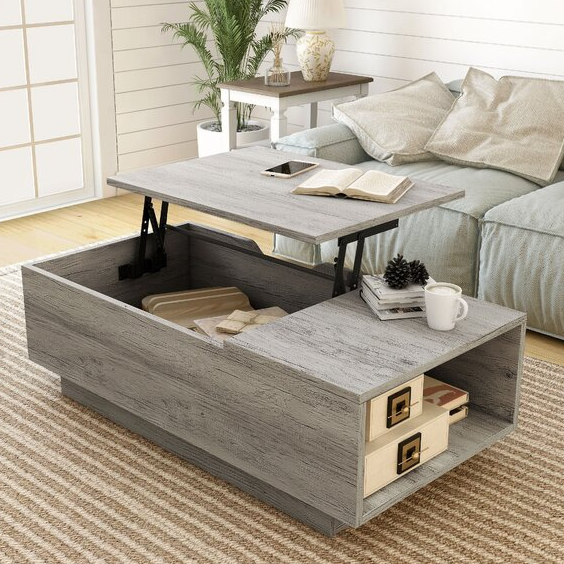 Lift-top coffee table with hidden storage compartment and side drawers, set in a living area with a couch and a side table.