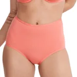 A woman is wearing a coral-colored bra and high-waisted underwear set.