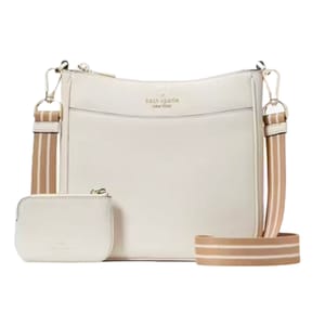 A cream-colored Kate Spade crossbody bag featuring a textured exterior, a gold logo, a striped strap, and an attached matching coin purse.