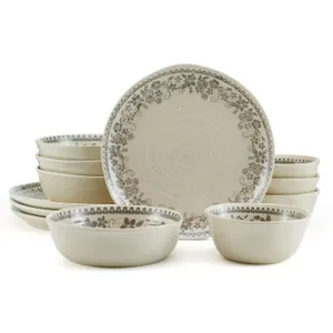 A ceramic dinnerware set with a floral pattern, including plates, bowls, and larger serving dishes, in a neutral beige tone.