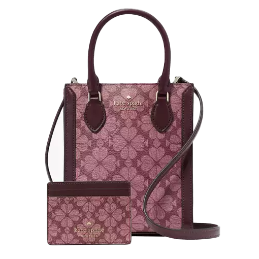 A small Kate Spade tote and matching card holder feature a pink floral pattern with burgundy leather details. The tote has top handles and a crossbody strap, and the card holder matches the same design and colors.