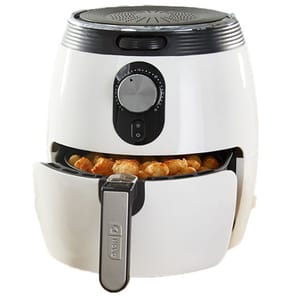 A white Dash air fryer with a black control panel and dial, containing crispy food items in the open drawer.