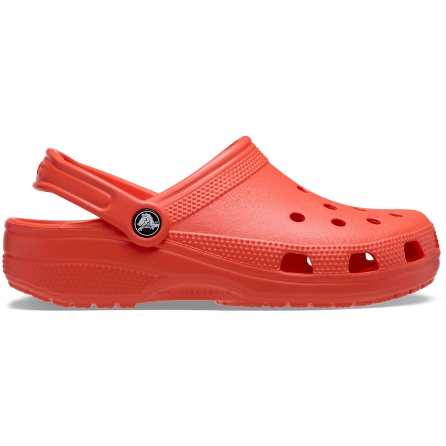 Red Crocs clog with ventilation holes, adjustable heel strap, and distinctive logo on the side.