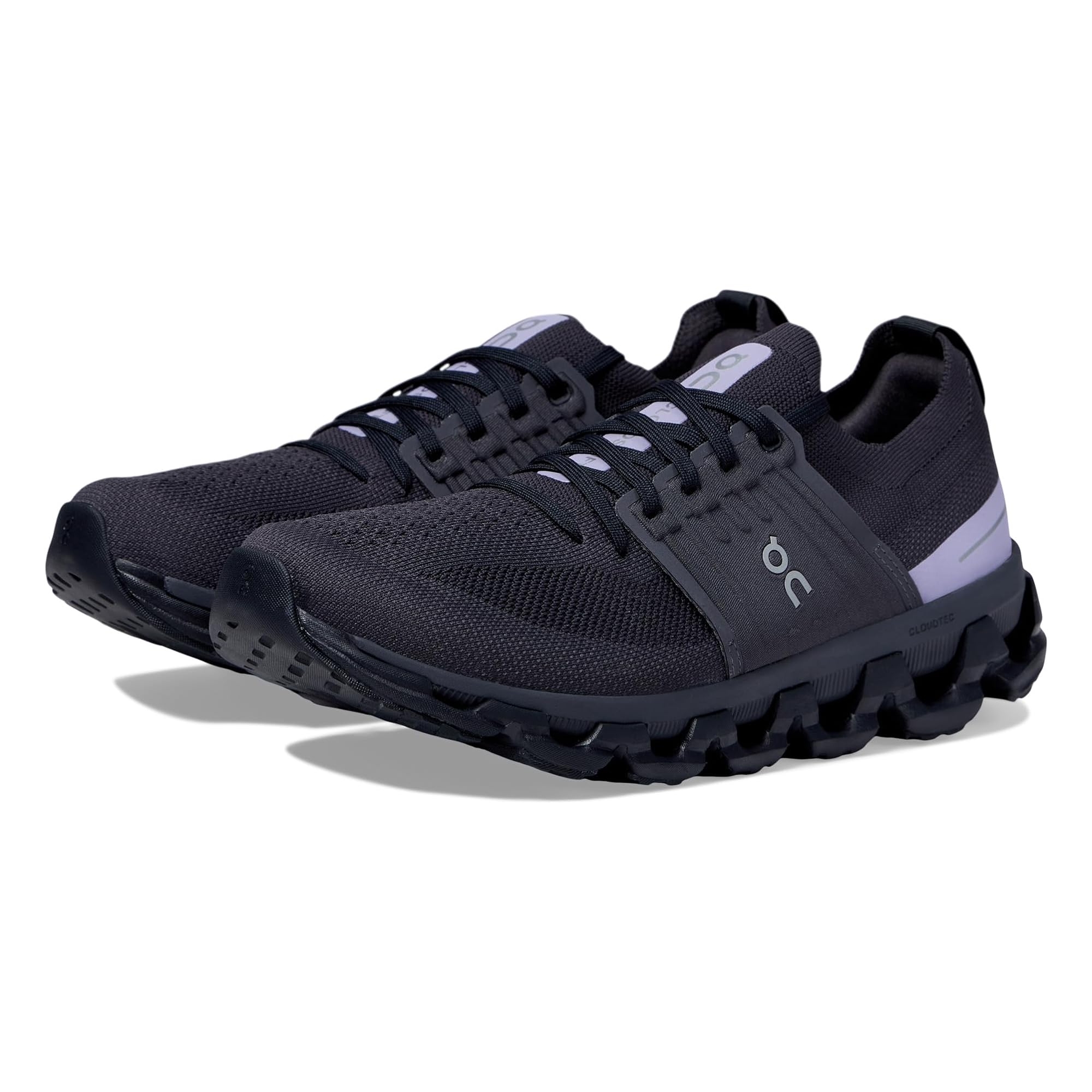 A pair of black athletic running shoes with white detailing on the heel.