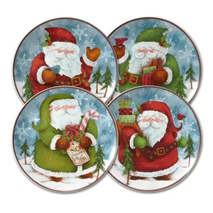 Set of four festive plates featuring Santa Claus in various red and green outfits, holding gifts and candy canes against a snowy backdrop with trees and snowflakes.