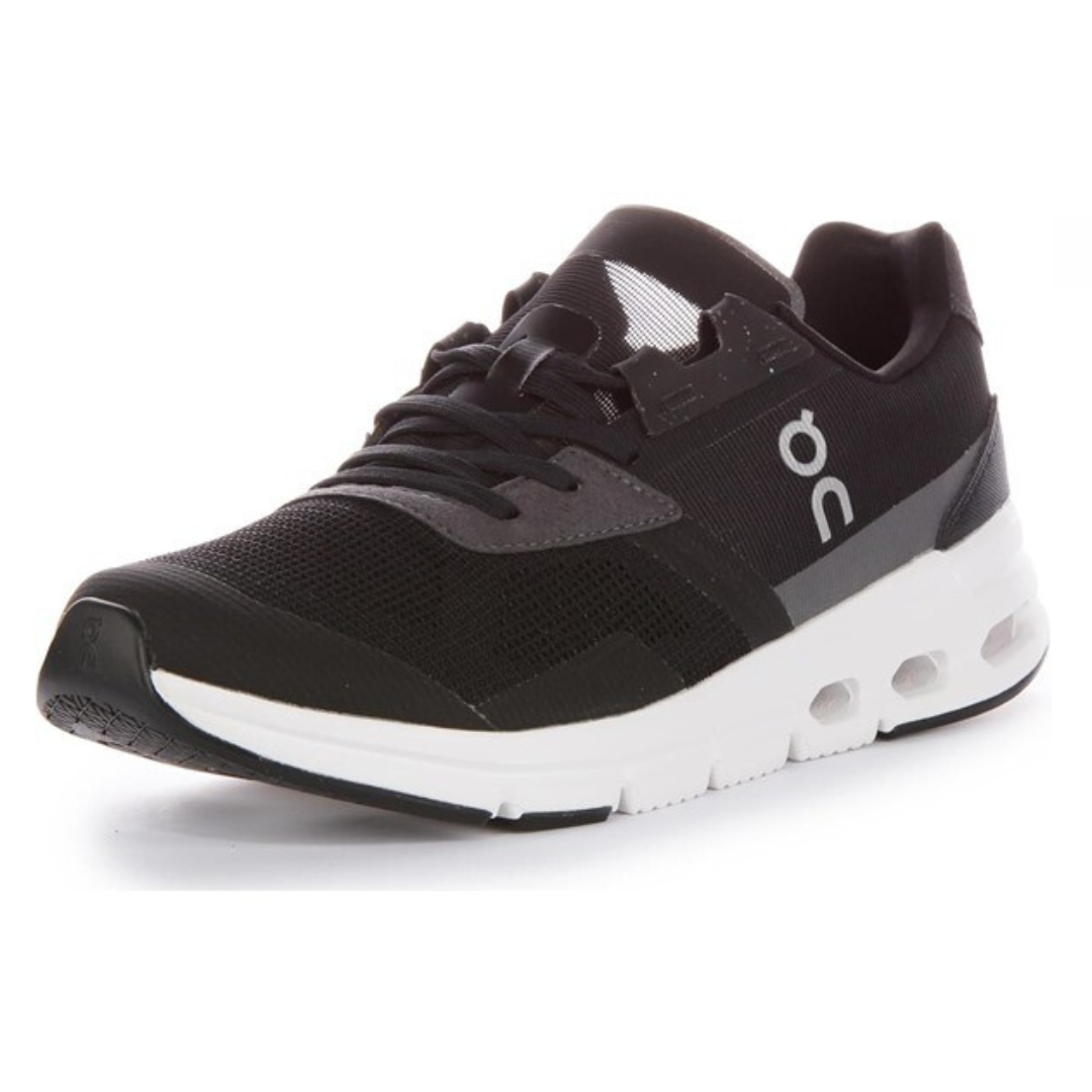 The On Running Cloudrift Shoes are black with a sleek, breathable mesh upper and feature a white midsole with signature CloudTec cushioning. They have a low-profile design with the On logo on the side.