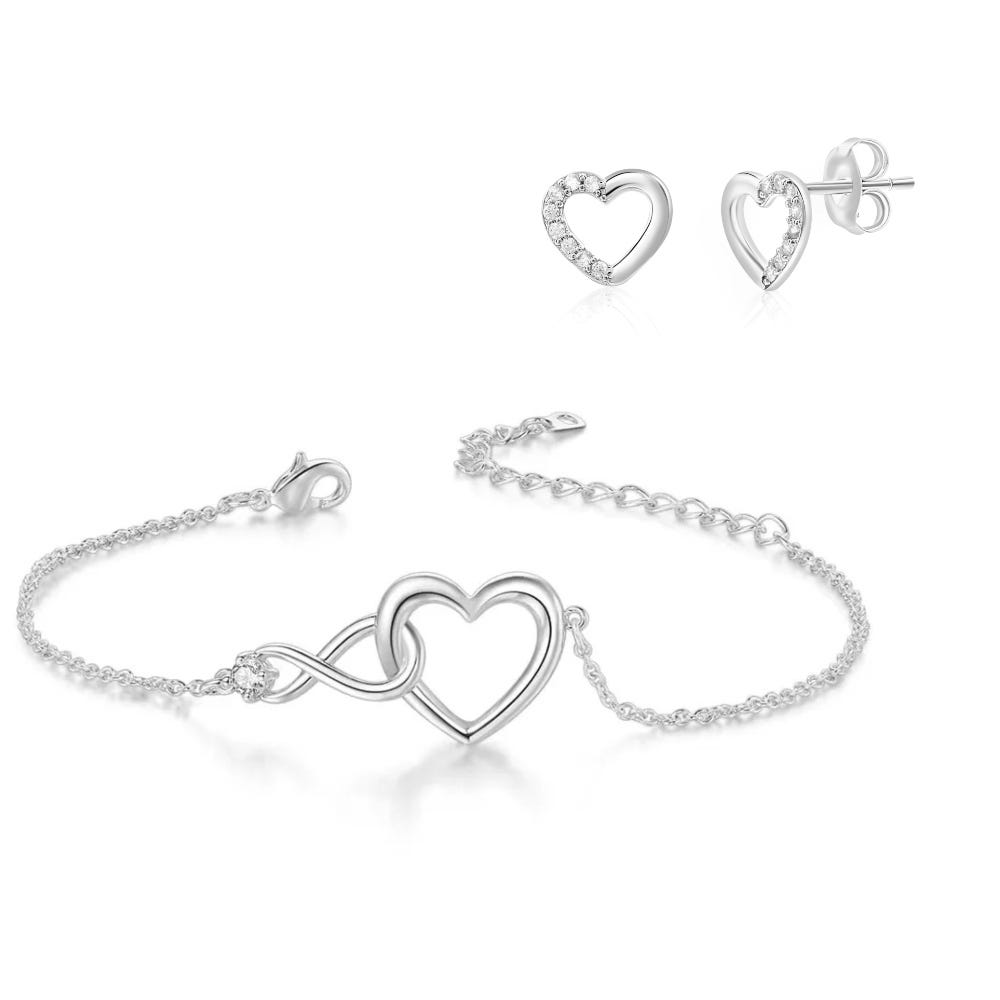 Silver bracelet with an intertwined heart and infinity symbol design, accompanied by matching heart-shaped stud earrings.