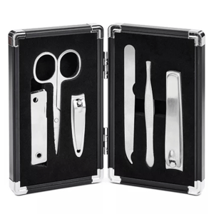 The Perry Ellis 6pc Men's Manicure Set includes scissors, nail clippers, a nail file, tweezers, a cuticle pusher, and a nail cleaner, all housed in a compact, black carrying case.