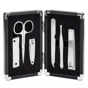 The Perry Ellis 6pc Men's Manicure Set includes scissors, nail clippers, a nail file, tweezers, a cuticle pusher, and a nail cleaner, all housed in a compact, black carrying case.