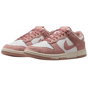 A pair of pink and white Nike Dunk low-top sneakers with suede accents and distinctive Nike branding on the side.