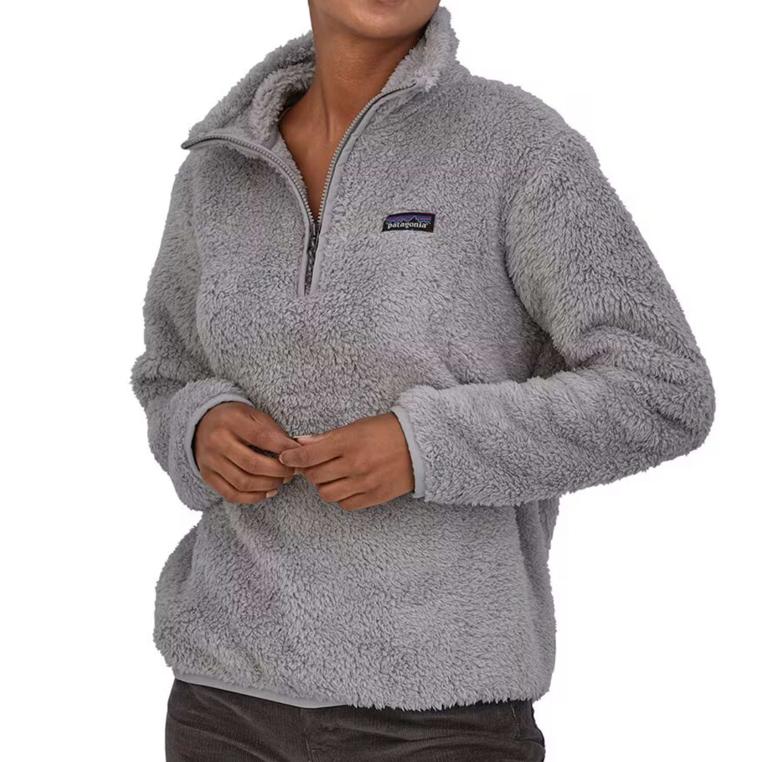 The Patagonia Los Gatos Jacket is a plush, gray, high-pile fleece jacket with a quarter-zip design, featuring a stand-up collar and a small logo on the chest.