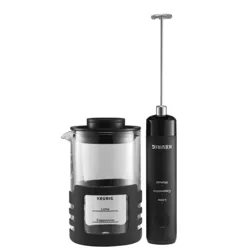 The Keurig SimpleCafe Frother set includes a handheld frother with a long whisk and a clear frothing pitcher marked for latte and cappuccino levels, featuring a black handle and lid.