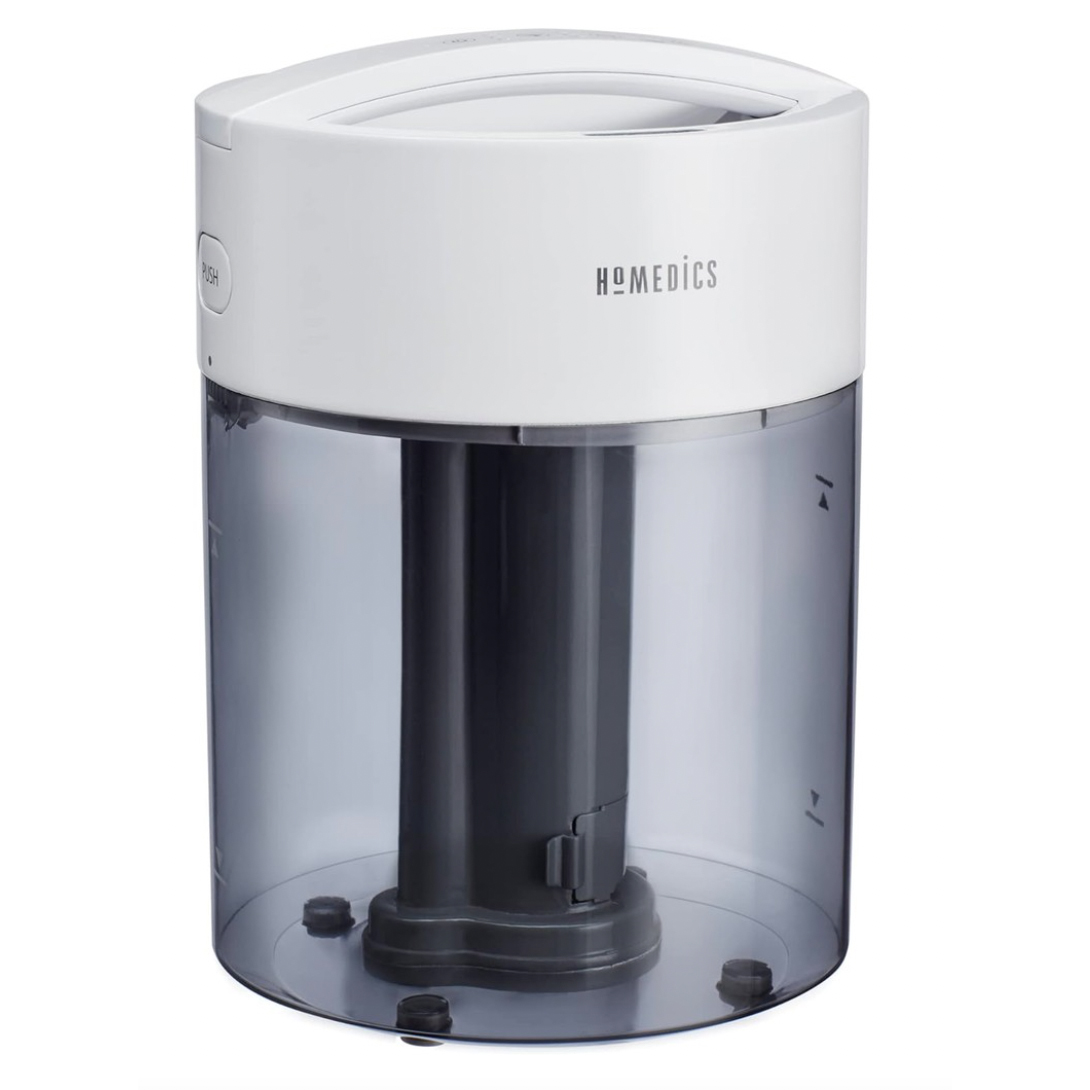 HoMedics Cool Mist Humidifier features a cylindrical tank with a clear, dark base and a white top. It includes a \“push\“ button feature for easy operation.