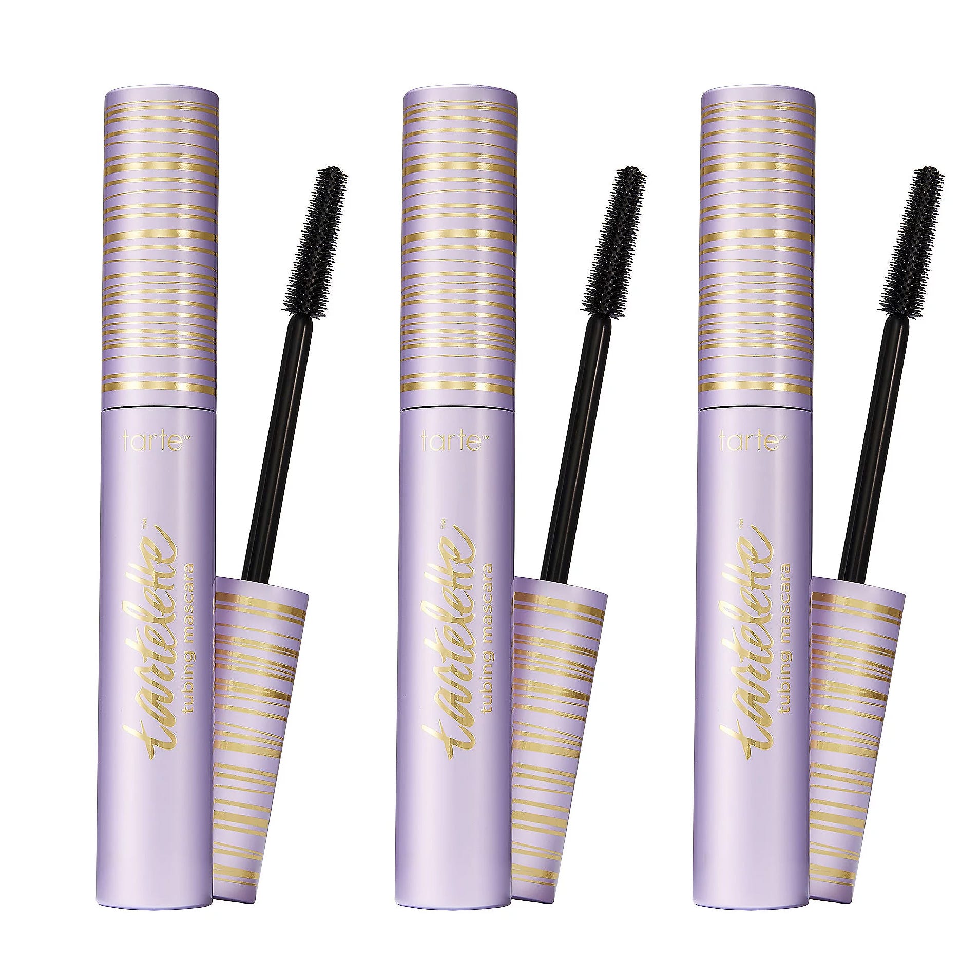 Three tubes of Tartelette Tubing Mascara with wands partially removed, featuring a lavender and gold design.