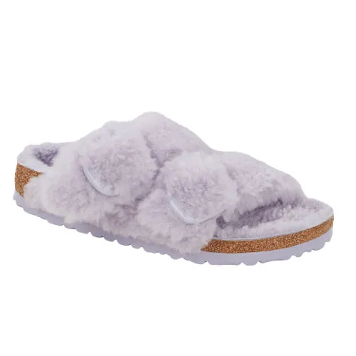 Light purple open-toe sandals with plush shearling straps and soft cork soles for comfort.