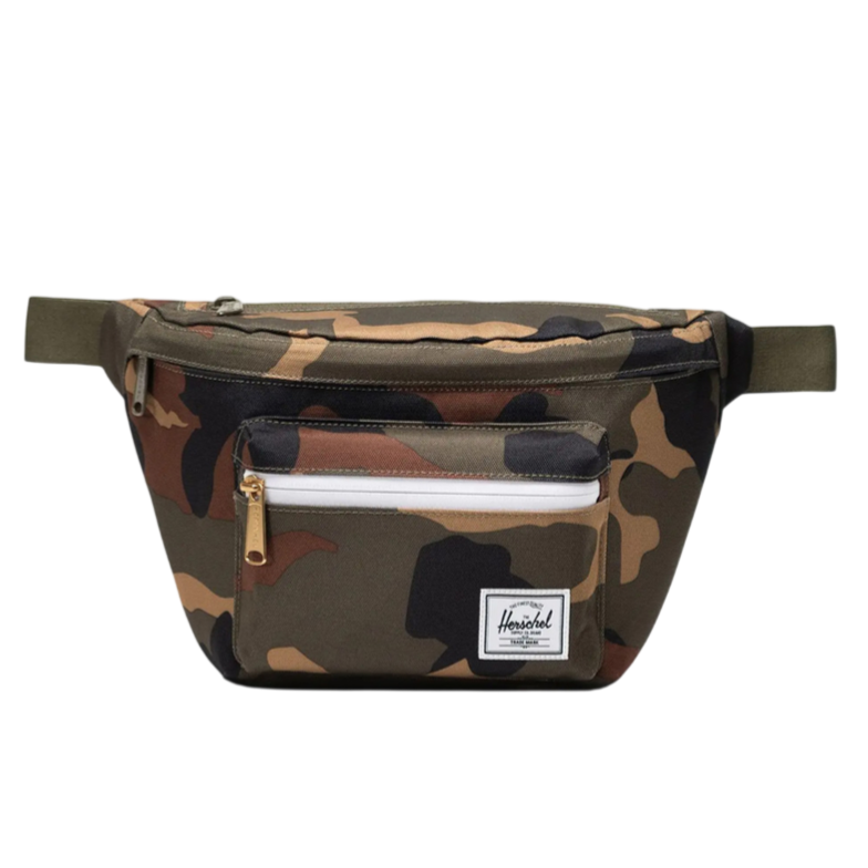 Camouflage waist pack with multiple compartments, including a front zip pocket and a label patch.