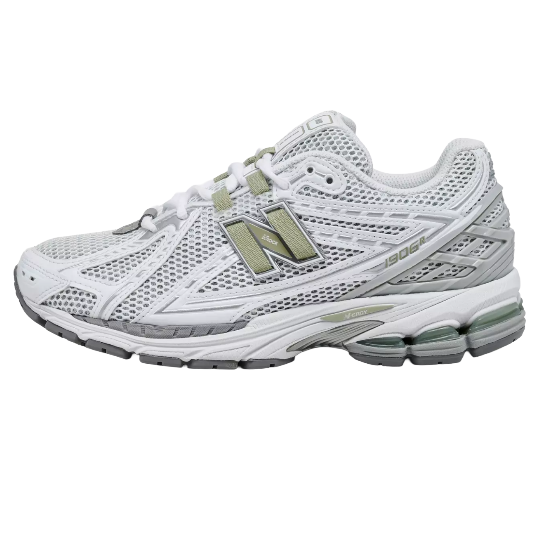 New Balance 1906R sneaker in white with grey and green accents, featuring a mesh upper and N-ergy cushioning in the sole.
