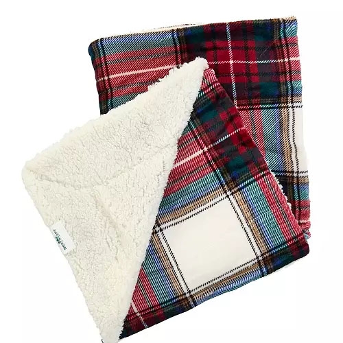 A cozy blanket with a red, green, and white plaid pattern on one side and a soft, cream-colored Sherpa fleece on the reverse, designed by Northeast Outfitters.