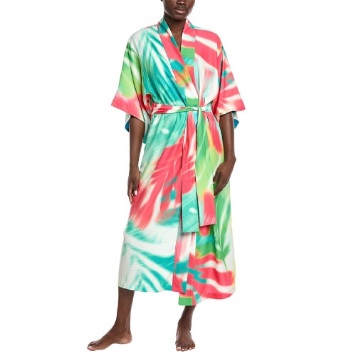 A person is wearing a colorful tie-dye kimono-style robe with shades of red, green, and white. The robe features wide sleeves and a matching belt for closure.