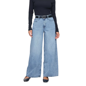 Mid-rise drapey soft baggy jeans with a light blue wash. Features include a loose fit, wide legs, front pockets, and a black belt. Paired with a black long-sleeve top and black shoes.