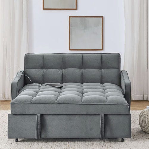 A grey quilted sleeper sofa.