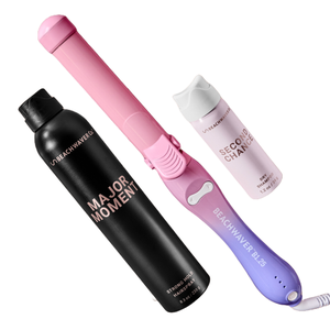 Beachwaver Essentials Hair Set includes a pink and purple rotating curling iron, a black Major Moment Strong Hold Hairspray (8.3 oz), and a pink Second Chance Dry Shampoo (1.2 oz).