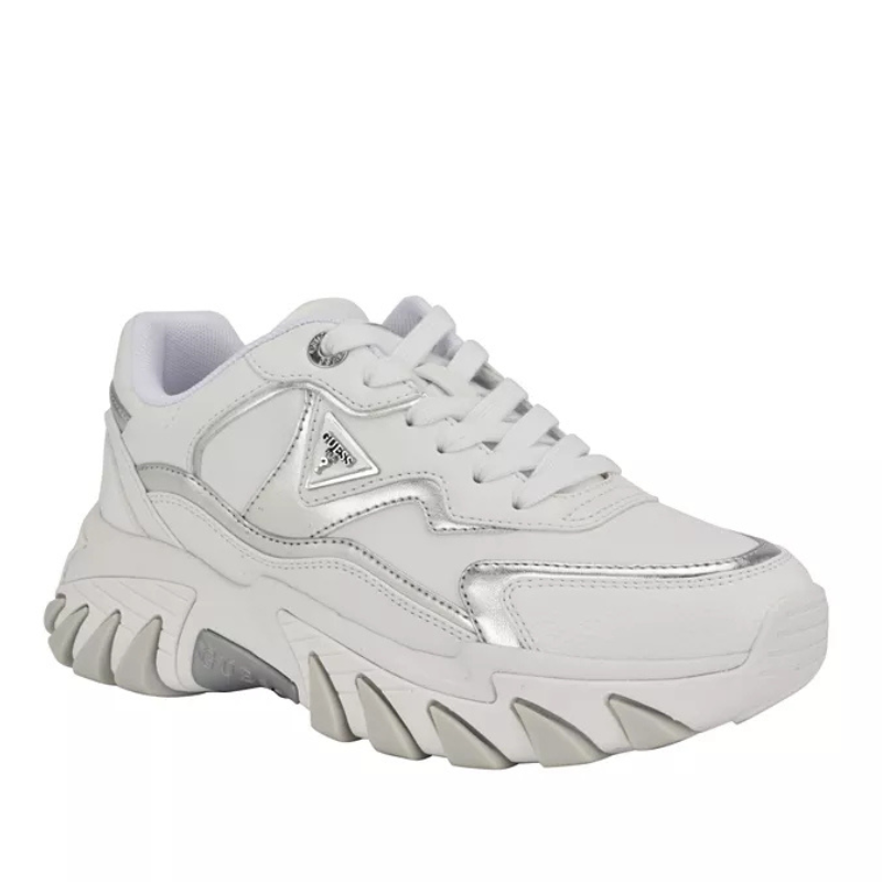 White chunky sneakers with a prominent triangular logo detail and bold, wavy soles.