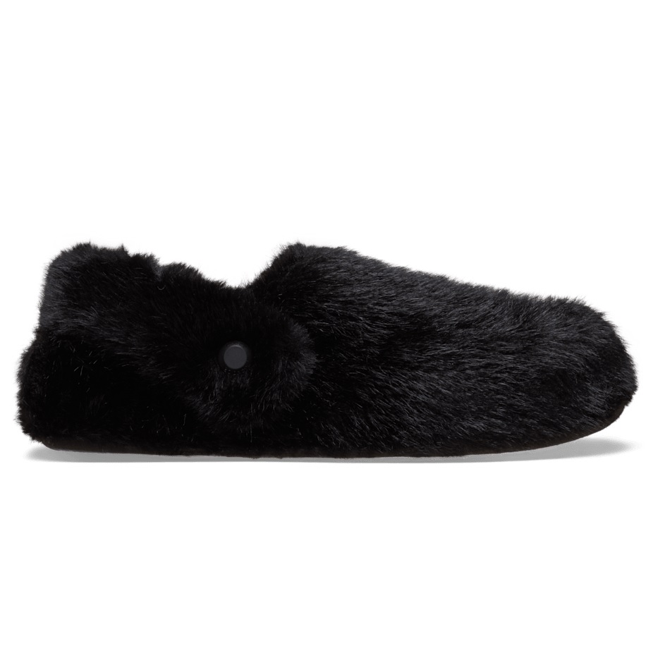 A black furry slipper with a sleek and simple design, featuring a button-like detail on the side.