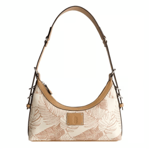 Tan and white shoulder bag with leaf patterns and a detachable strap, featuring leather trim and a small logo patch on the front.