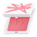 Fenty Beauty compact featuring a pink blush with a white lid marked by a pink \“X\“.