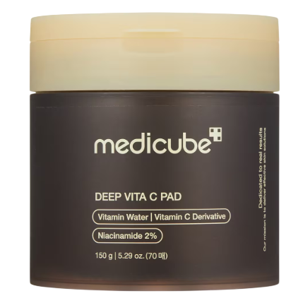 Medicated skincare jar labeled \“medicube Deep Vita C Pad\“ containing Vitamin Water, Vitamin C Derivative, and 2% Niacinamide; 150 g (5.29 oz) capacity with 70 pads.