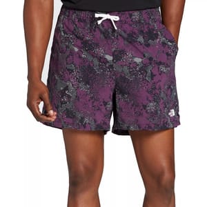 The North Face Men's 5\“ Woven 2.0 Shorts feature a purple and black abstract pattern with an adjustable white drawstring. They include side pockets and a small brand logo near the hem.