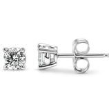 A pair of solitaire diamond stud earrings set in a four-prong metal setting with butterfly backs.
