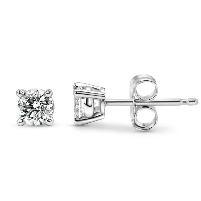A pair of solitaire diamond stud earrings set in a four-prong metal setting with butterfly backs.