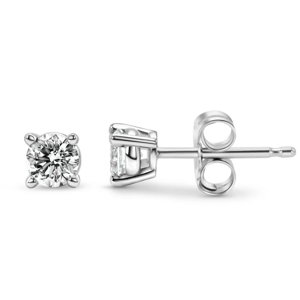 A pair of solitaire diamond stud earrings set in a four-prong metal setting with butterfly backs.