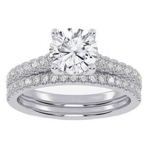 A silver engagement ring set with a large central diamond and smaller diamonds encircling the band.
