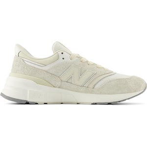 The New Balance 997 sneakers feature a clean, cream color scheme with suede and mesh detailing, a thick rubber sole, and the signature \“N\“ logo on the side, offering a classic, minimalist look.