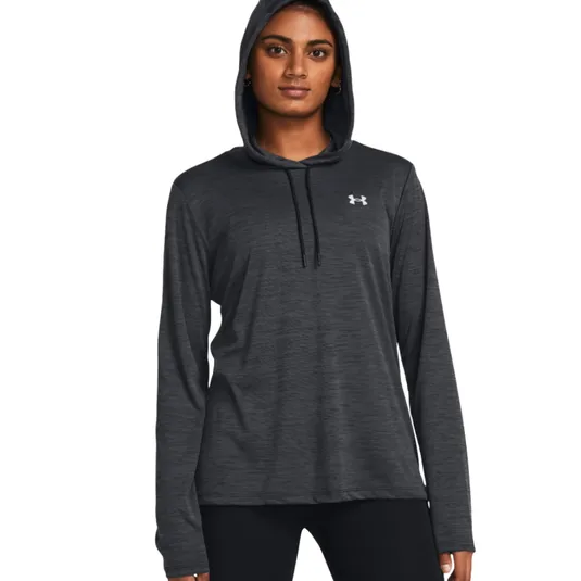 A person is wearing a dark gray Under Armour hoodie with a small logo on the chest, paired with black pants.