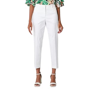 White cropped pants with a tailored fit, paired with a floral patterned top and white heeled sandals.