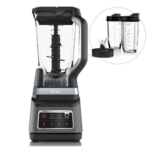 Ninja blender with Auto-iQ technology, featuring a large pitcher for blending and additional single-serve cups with a detachable blade for smoothies and extractions.