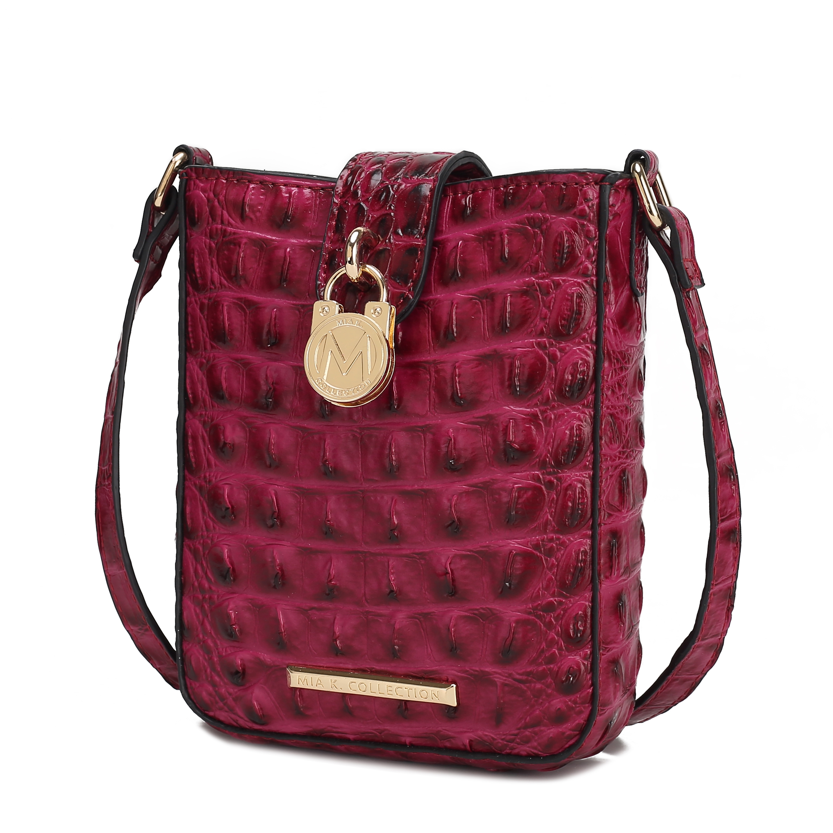 Red crocodile-patterned crossbody bag with gold-tone hardware, decorative emblem, and an adjustable strap.