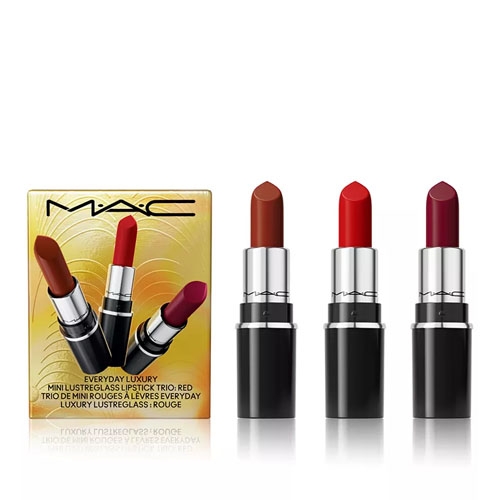 three mac lipsticks next to a gold box