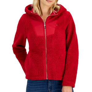 A red sherpa jacket with a hood, zippered front, and a small logo on the left chest.